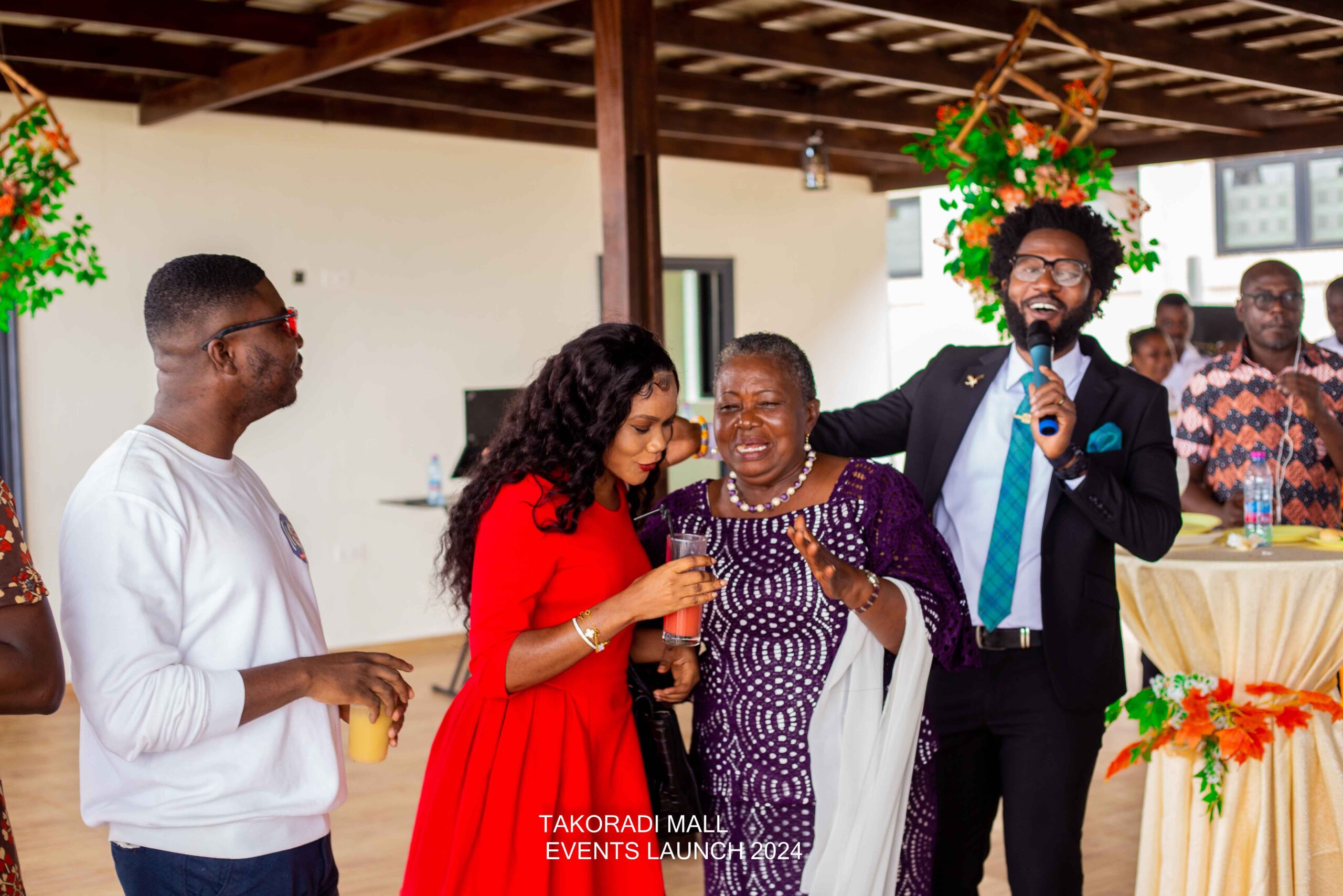 Guests engaging in candid conversations during the Takoradi Mall Event Centre launch.